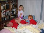 Kids tickling dad