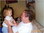 Laurel bounces on Grandpa's lap